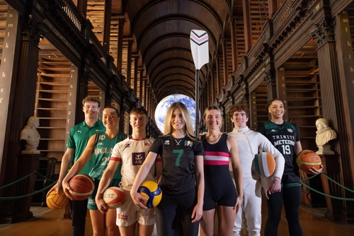 Trinity Sport Scholars 2024-2025 in the Old Library with the Gaia globe-projection artwork in the background