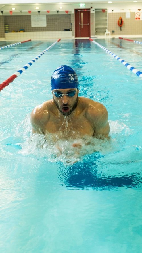 A person swimming in the Sport TCD Swimming Pool