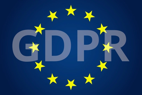 The letters GDPR on a EU blue background, surrounded by the golden star circle that represents the EU