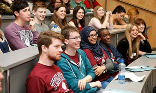 Students in a packed lecture theatre