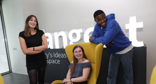 Three young people in the Tangent offices participating in Launchbox