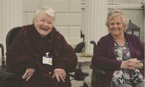 Two older ladies smiling