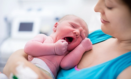 Mother holding newborn baby