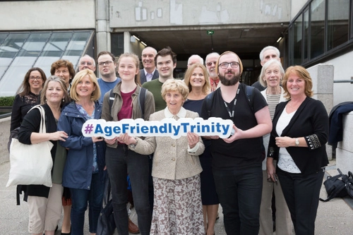 a group holding a sign