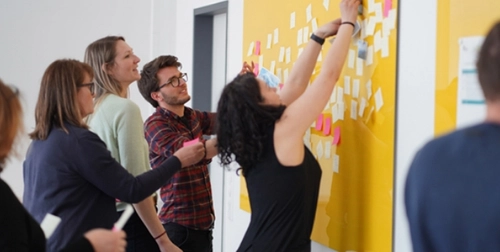 People collaborating in a design thinking session