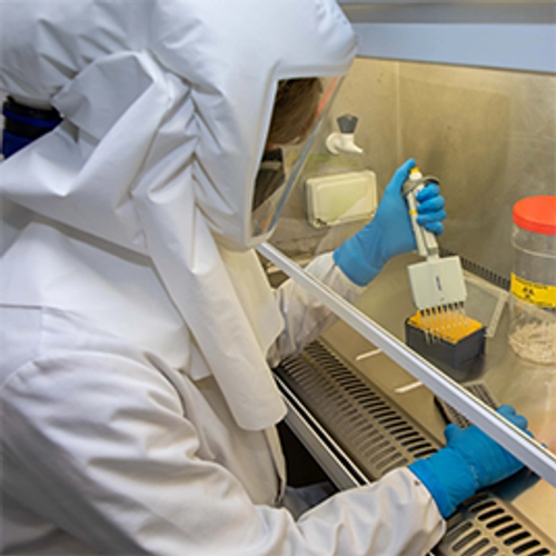 lab worker in hazman suit