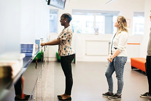 people queueing at service desk