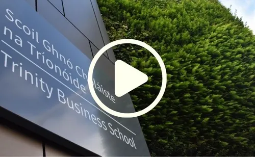 An external shot of the school with the programme name overlaid