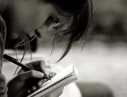 Girl Writing in Notebook, Black and White Image