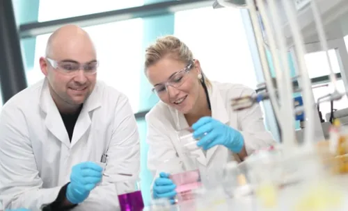 Image of a man and woman working in a science lab