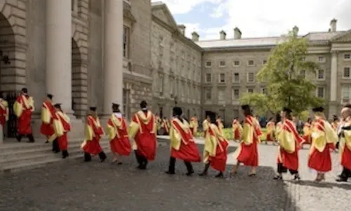 Graduates gathering entering the exam hall building graduation ceremony