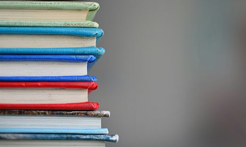 Stack of colourful notebooks