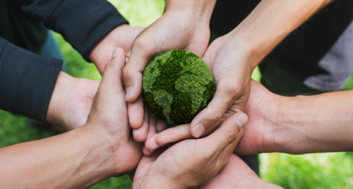 Graphic of mountains, the sun and wind turbine