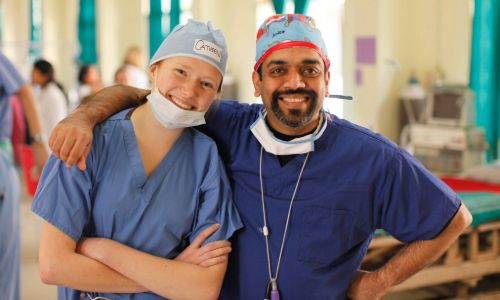 Two medical professionals hugging
