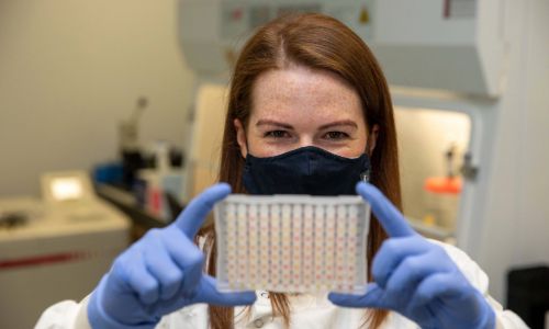 A scientist examining test results