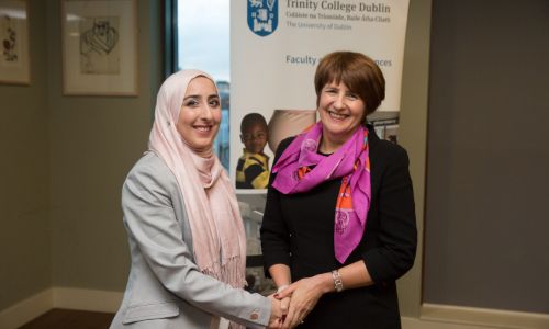 Professor Mary McCarron posing in a photo with a colleague