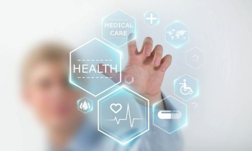 A person moving cards around on a touchscreen. The picture is taken from behind the touch screen