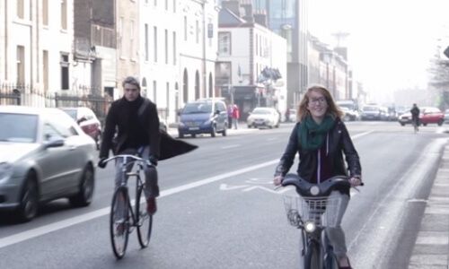 Video still of people cycling through Dublin