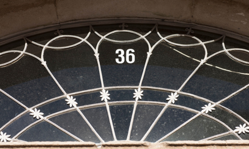 Door fanlight inscribed with number 36