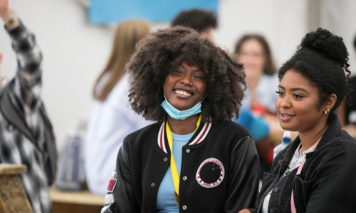Two Trinity students laughing at Fresher's week.