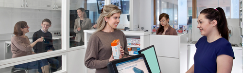 A patient collecting a prescription from a pharmacy