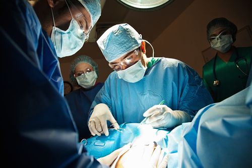 Doctors performing a Caesarian