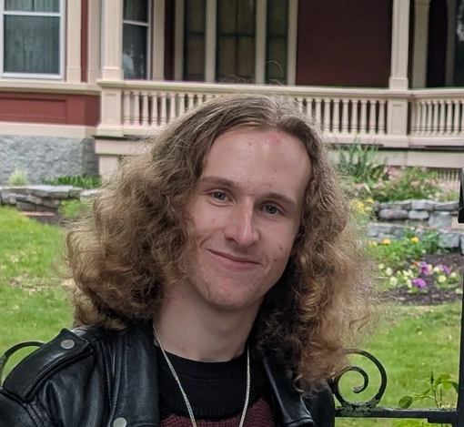 Student with long curly blonde hair