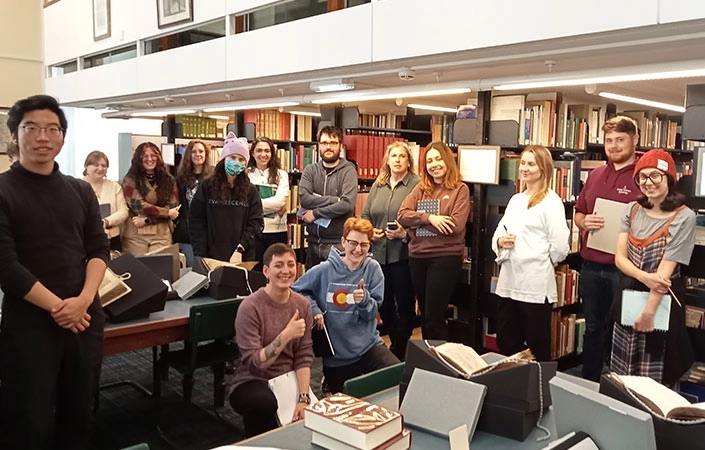 smiling group of students in the library