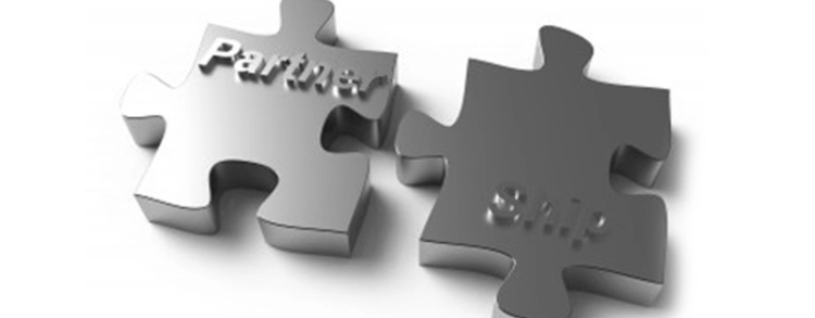 Two jigsaw pieces saying partner