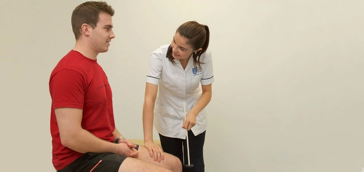 Physio working on a patient's knee issue