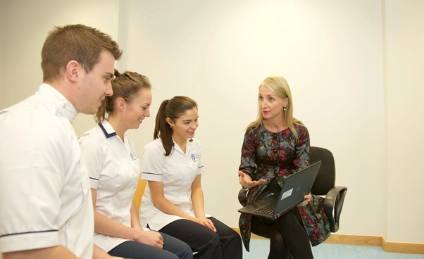 students talking to tutor