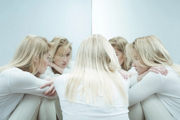 girl looking in mirror