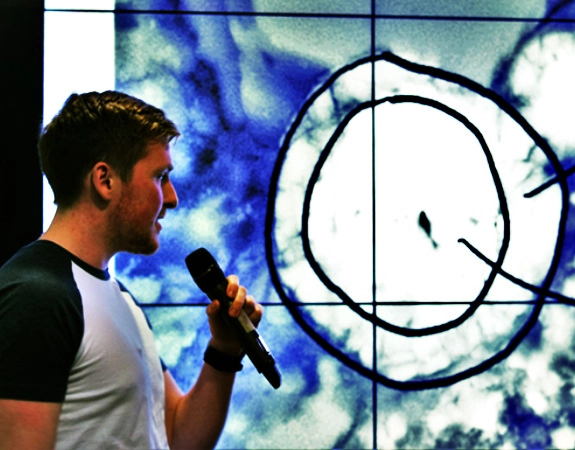 Postgraduate science student presenting research/work.