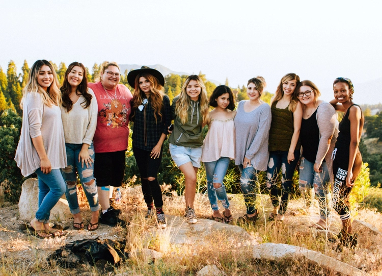 Group of women standing next to each other