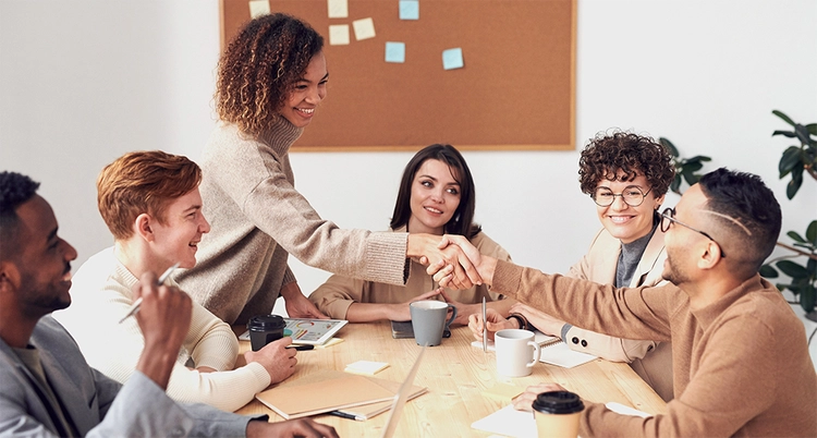 A Group of people meeting and shaking hands