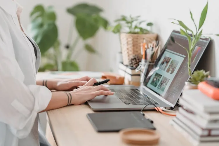image of a woman sitting at computer desk