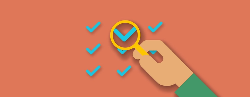 A cartoon graphic of a magnifying glass and some tick marks.