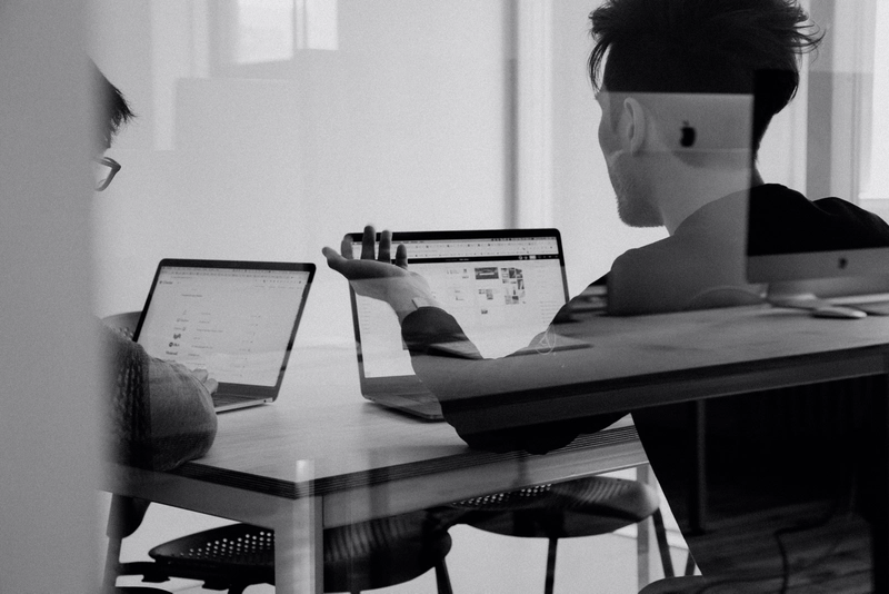 two students studying with computers