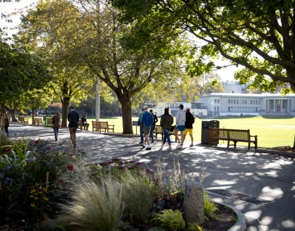 Students walking on the grounds of Trinity College Dublin.