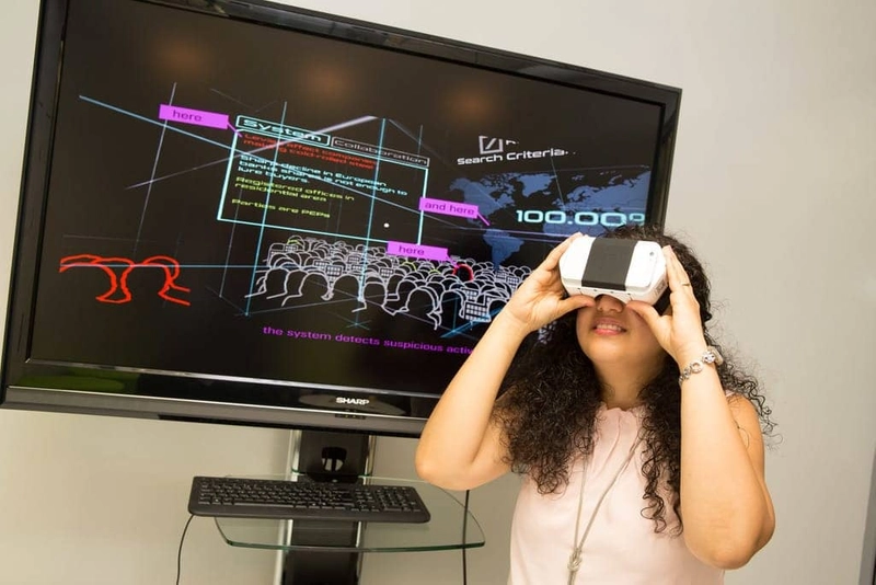 A person viewing virtual reality with VR glasses