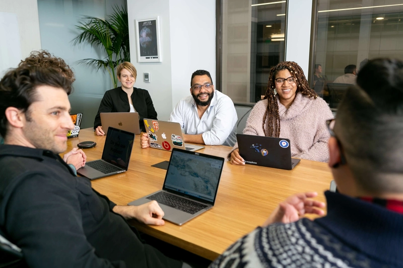Office meeting with laptops