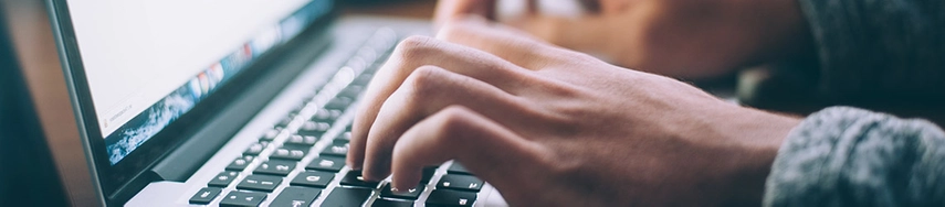 Person typing on laptop