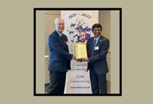 Professor Roger West being presented with his certificate by ICT President, Professor Muhammed, Basheer of the University of Leeds