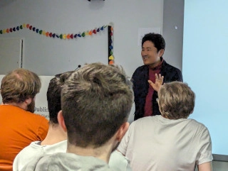 Japanese documentary film-maker Kazuhiro Soda speaking to Trinity students in Trinity Global Room