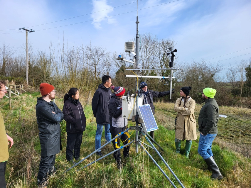 Researchers around equipment