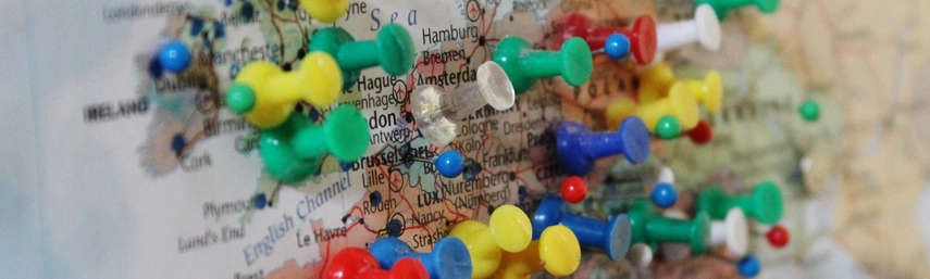 Coloured pins on a map of Europe.