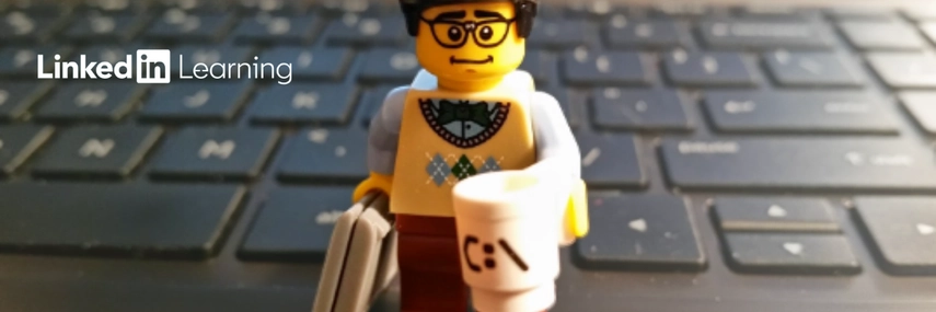 an image of a lego man standing on a laptop keyboard