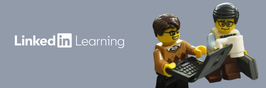 image of two lego men with one holding a laptop