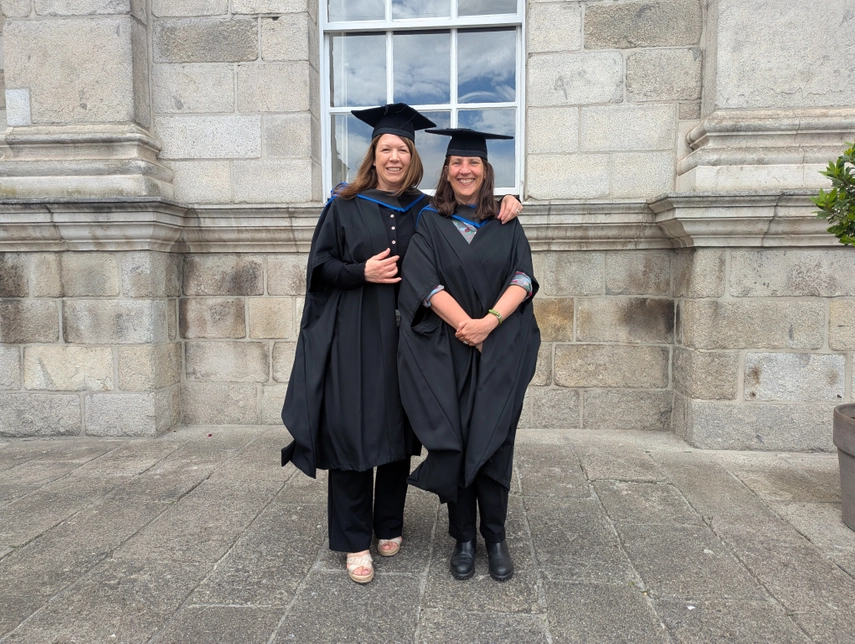 image of Sara and Nicola in graduation gowns