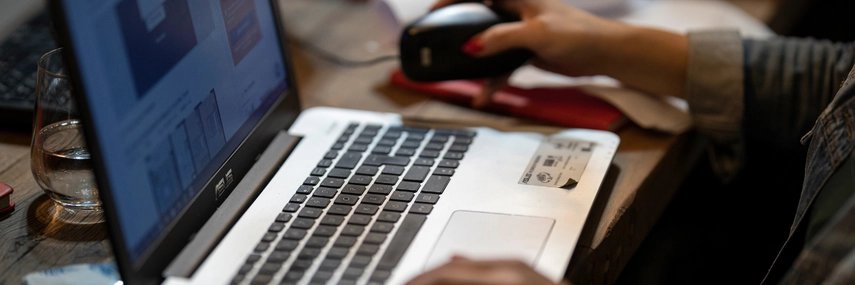 hands working on a computer